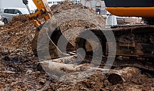 Dirty excavator bucket on the construction site