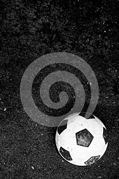 Dirty football, soccer ball move to forward black and white image