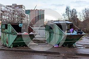 dirty garbage containers, dumpsters with household rubbish