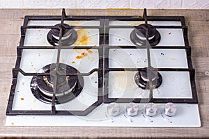 Dirty gas hob  soiled in cooking  stove in grease. Unsanitary conditions