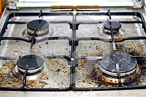 Dirty gas stove. Grease contamination on the stove.