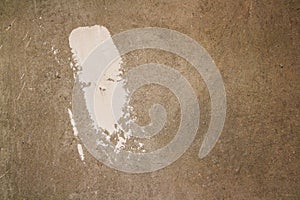 Dirty grey concrete wall making an abstract background. Blots of