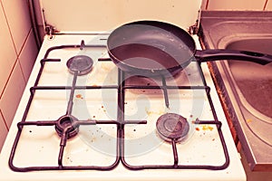 Dirty grubby gas stove in kitchen