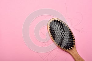 Dirty hair brush, Grey lint dead skin cell residue on unclean comb photo