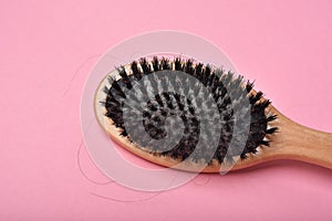 Dirty hair brush, Grey lint dead skin cell residue on unclean comb, Poor hygiene head scalp photo