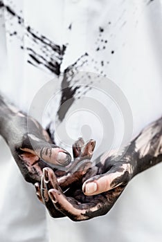 Dirty hands with black gold - oil