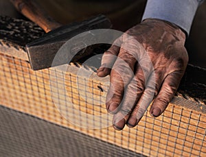 Dirty hands of blacksmith
