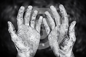 Dirty male hands after hard physical work in a black and white shot