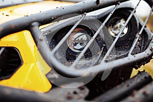 Dirty headlamps ATV in the woods