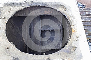 Dirty impeller of a low pressure centrifugal fan in a large supply and exhaust system, the foreground and background are blurred w