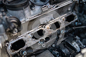 Dirty intake manifold. Close up of dirty intake manifold ports. Engine cleaning process the intake manifold.