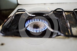 Dirty kitchen. Unsanitary conditions. Old gas stove in emergen photo