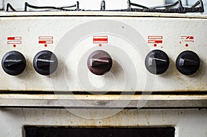 Dirty kitchen. Unsanitary conditions. Old gas stove in emergen photo