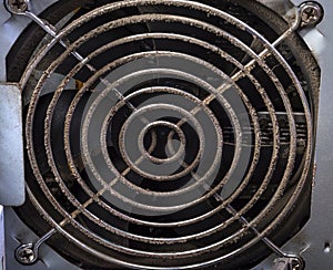 Dirty metal lattice of the fan, computer, close-up