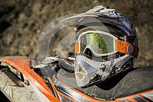 Dirty motorcycle motocross helmet with goggles