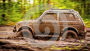 Dirty off-road car at a speed over dirt