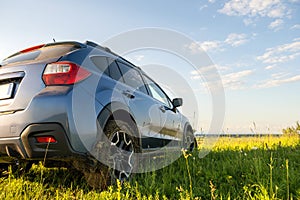 Dirty off road car wheels with dirty tires covered with yellow mud