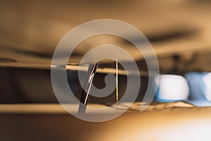 Dirty oil flows out of the engine into bowl