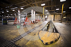 Dirty, oily bus garage inspection pit