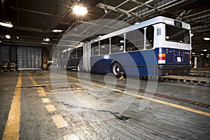 Dirty, oily bus garage inspection pit photo