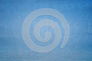 Dirty old blue mesh fabric texture as background