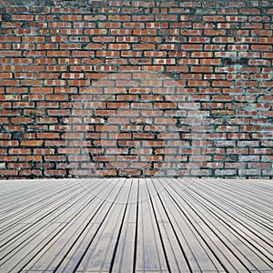 Dirty old bricks wall with wooden floor