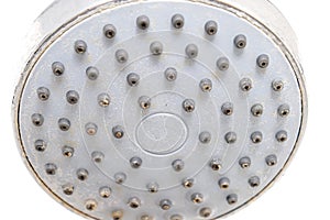 Dirty old shower head close up with limescale and calcified, rusty shower tray and mould tiles on background, cleaning