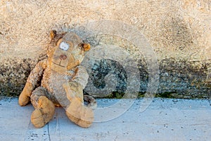 A dirty and old teddy bear