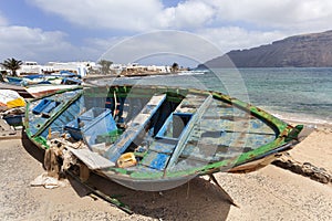 Dirty old weathered broken boats on La Graciosa