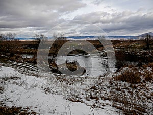 Dirty olt river at wintertime