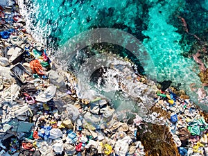 Dirty plastic bottles and bags garbage. Ocean pollution in water recycle Asia and India concept. Aerial top view