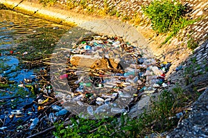Dirty polluted waste water with garbages. Environment pollution concept. Urban environment issues in Orsova, Romania, 2020