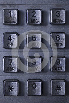 Dirty public telephone metal keypad