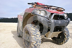 Dirty red ATV