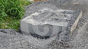 Dirty road under construction and drain pipe