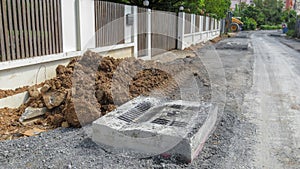 Dirty road under construction and drain pipe