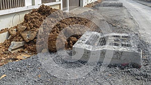 Dirty road under construction and drain pipe