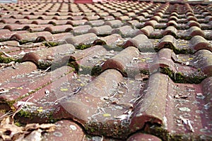 Dirty roof tiles requiring cleaning