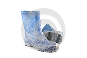 Dirty rubber boots isolated on white background