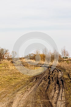 Dirty rural road in early spring