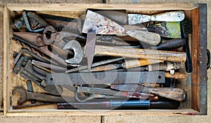 Dirty set of hand tools, vintage background with old tools