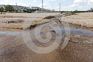 Dirty sewage and household rubbish in small river, irrigation channel causes rapid growth of algae. Water pollution. Ecological pr