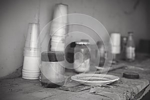 Dirty shelf with dishes in an abandoned house