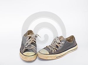 Dirty shoe on isolate white background , close up shoe,dirty blue shoes on the white background , canvas blue shoes ,old