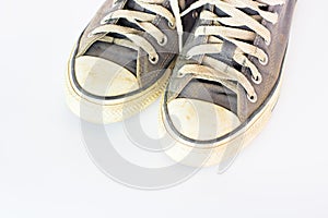 Dirty shoe on isolate white background , close up shoe,dirty blue shoes on the white background , canvas blue shoes ,old