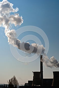 Dirty smoke on the sky from the pipes of the factory. Industrial chimneys air pollution