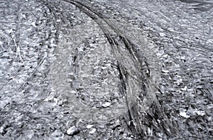 Dirty snow with ski tracks