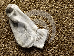 Dirty sock on the floor