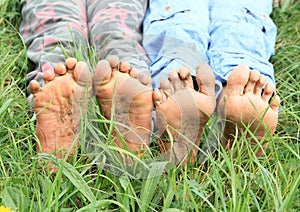 Dirty soles of bare feet