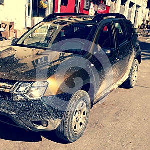 Dirty SUV car after off road ride in georgian mountains